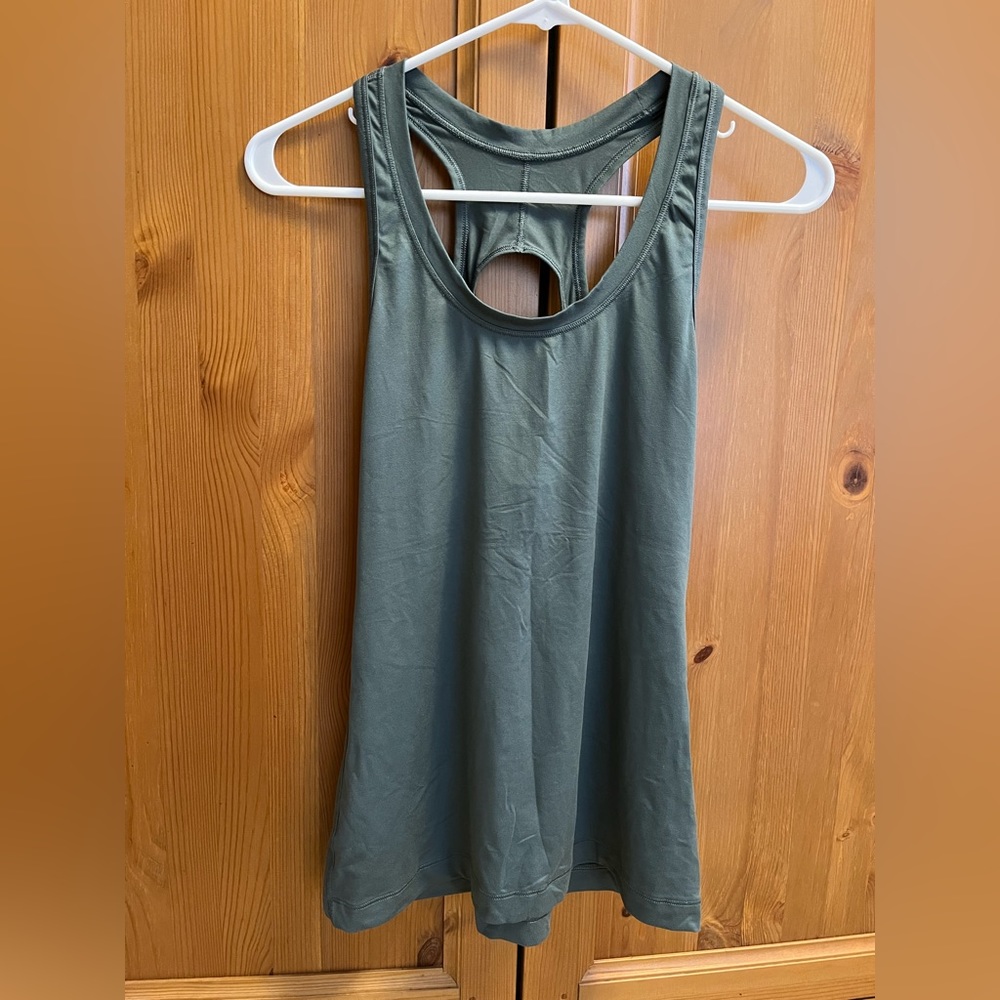 Athleta tank top- scoop neck and cut out back color green Women's size s